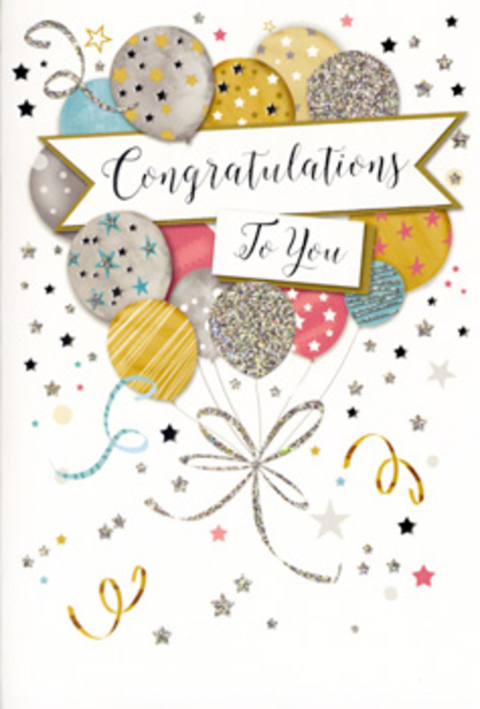 In this photograph, a refined congratulations card stands upright, its design radiating the quiet excitement that often fills Putney's streets when good news is shared. At the heart of the card is a lush cluster of illustrated balloons, arranged in a loose, organic bouquet that appears to float upward. The balloons are rendered in a gentle palette of polished gold, cool silver, champagne, sky blue, blush pink, and misty grey, their surfaces decorated with a mix of glittering textures, slender metallic stripes, and scattered tiny stars. These decorations suggest a subtle shimmer, as if they would catch the light streaming through a window overlooking Putney High Street. From the balloon bases, fine strings of gold and silver ink trail downward, curling and looping gracefully as they cross over one another, eventually gathering into a tidy flourish that anchors the image visually without weighing it down. Around the balloons, small stars and specks of confetti drift lightly, accompanied by slim, swirling ribbons that give the entire scene a sense of motion, like party streamers lifted by a soft breeze near Putney Heath. A gently curved banner runs across the middle of the card, carrying a neatly scripted congratulations message in flowing calligraphy that feels both polished and personal. The background is soft and neutral, allowing the pastel tones and metallic accents to glow with understated glamour. The card's overall mood is celebratory yet timeless, perfectly suited to accompany a hand-delivered bouquet from Flowers Putney for graduations, promotions, or any cherished milestone that calls for pride, affection, and a touch of sparkle.